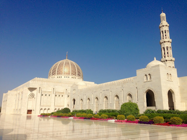 The serene white cityscape of Muscat, where the mountains meet the sea.