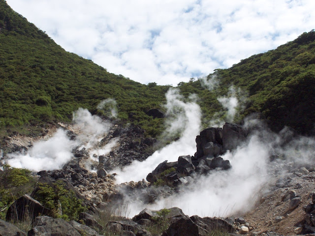 Rising white sulfur smoke and volcanic terrain at Owakudani, Hakone.